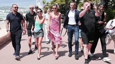 Bella Hadid (center) is seen wearing a keffiyeh-inspired dress by Michael and Hushi during the 77th Cannes Film Festival on May 23, 2024. Jacopo Raule