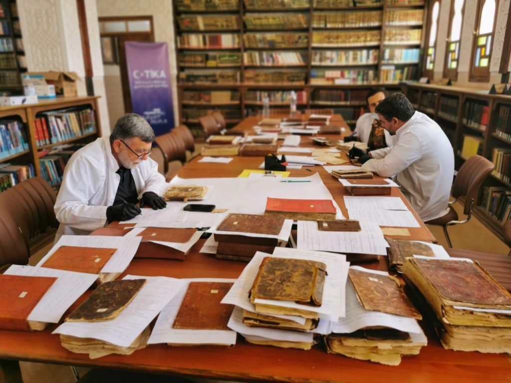 TİKA's team working on preserving and digitalizing Ottoman manuscripts in Laghouat, Algeria.