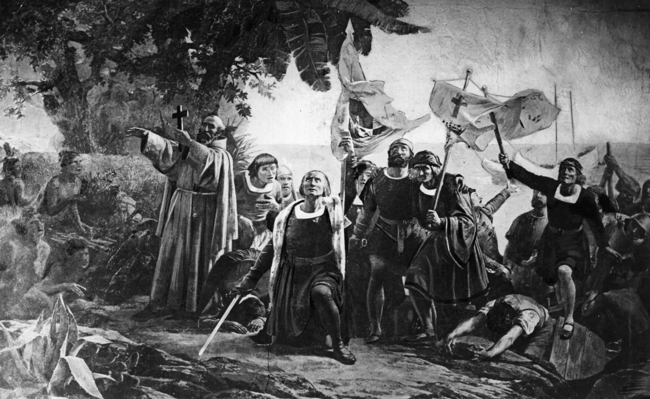 An artwork from the 19th century shows Christopher Columbus landing in America with the Piuzon Brothers bearing flags and crosses in 1492. (Getty Images Photo)