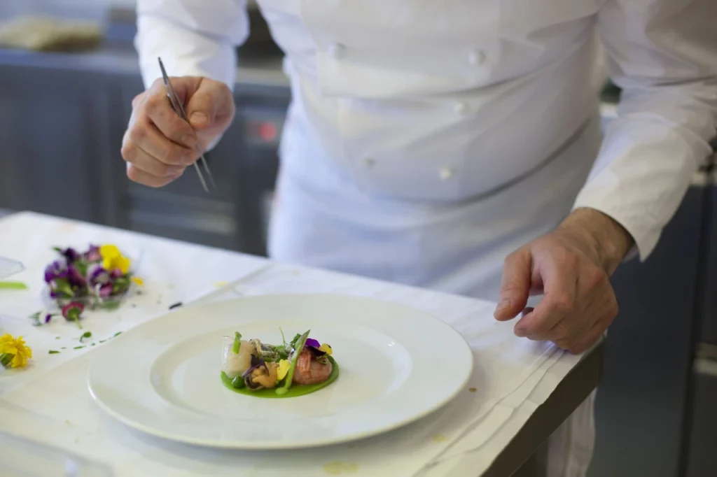 A chef decorates a plate for a special meal, November 7, 2023. (AA Photo)