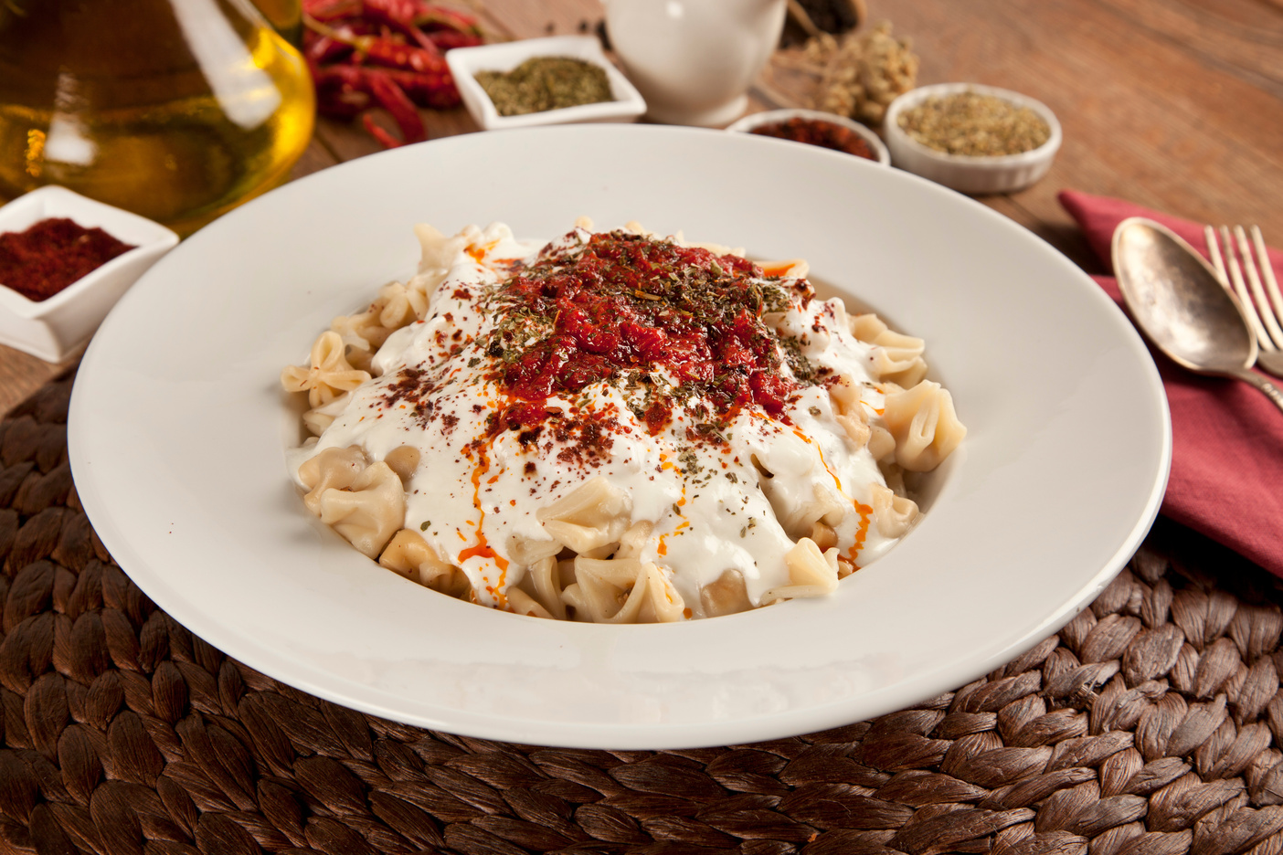 Traditional Turkish dumplings topped with garlic yogurt and a rich butter sauce infused with spices